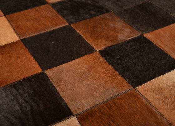 Leather Rug: Handmade patchwork rug manufactured by using natural cow leather imported from Southern America
